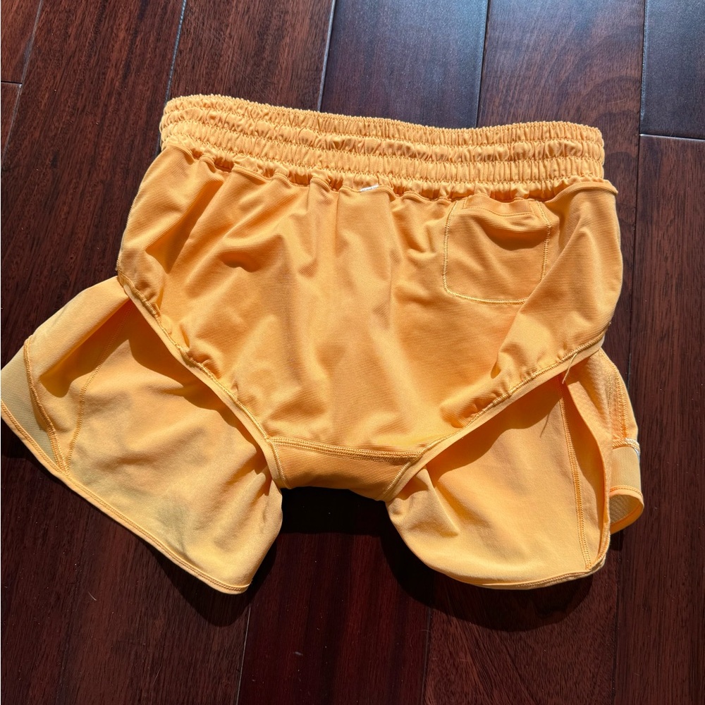 Selling Lululemon shorts size 6 in orange color - Picture 8 of 9
